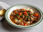Sous vide beef bourguignon with slow-cooked beef, red wine sauce, bacon, mushrooms, and herbs.